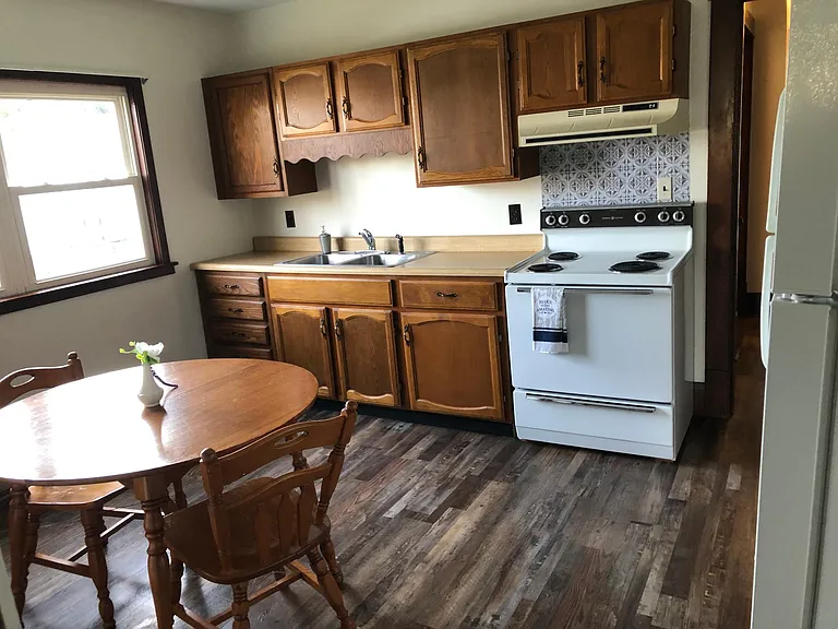 Large eat-in kitchen with stove and refrigerator