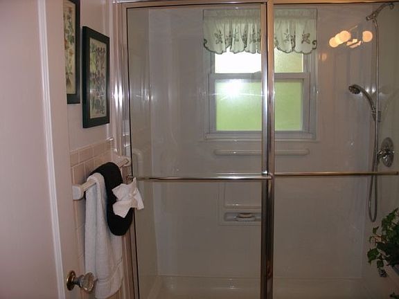 First floor bathroom has a stand-up shower, tiled flooring, w/a linen closet!