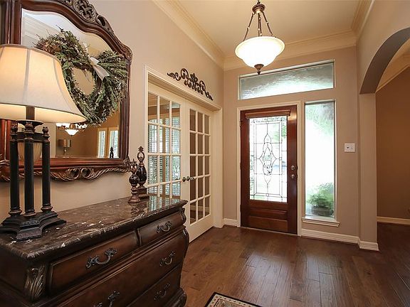 Just behind the grand french doors is a magnificent formal study that is directly across this foyer from an expansive formal dining room.