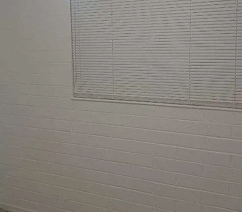 Window and interior wall — apartment 2 at 3245 West Jefferson Apartments.