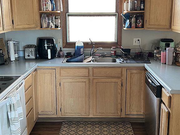 Large kitchen with new micro and dishwasher! Nice view to backyard over sink.