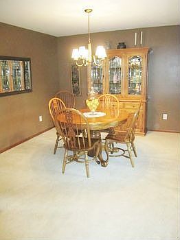 Dining Room with double glass doors to sun room.