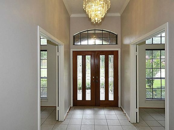 GRAND FOYER WITH ENTRANCES INTO THE DEN AND DINING AREAS!!