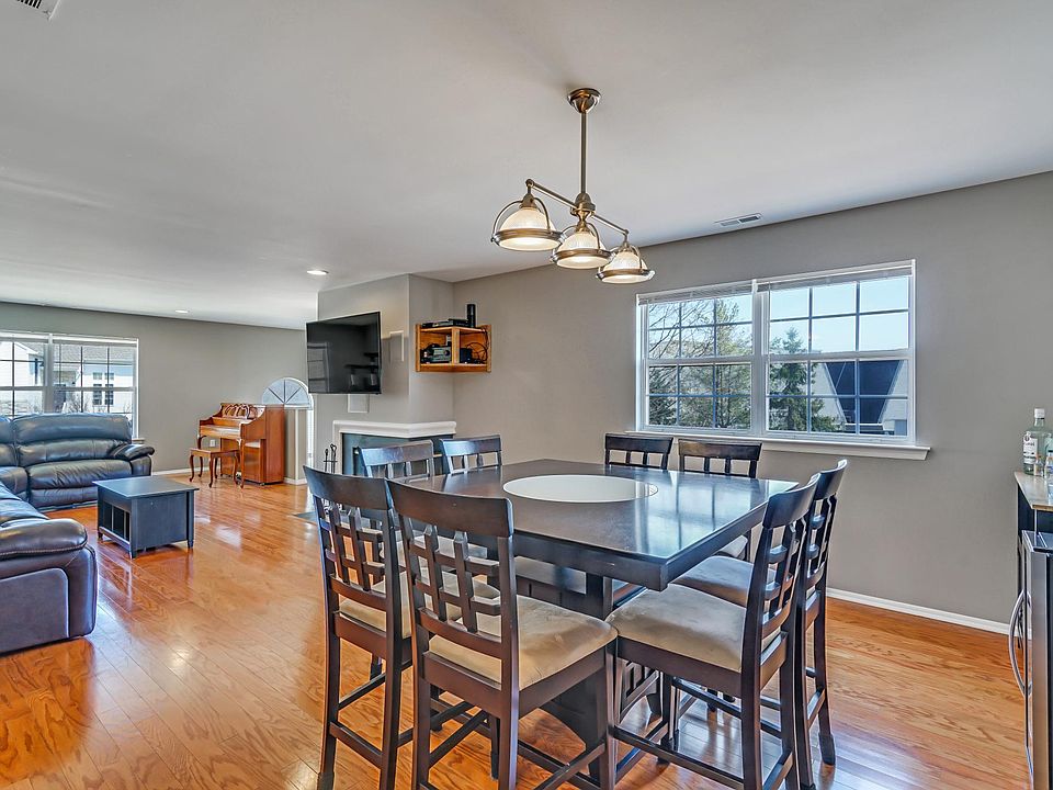 Open living room with wood burning fireplace