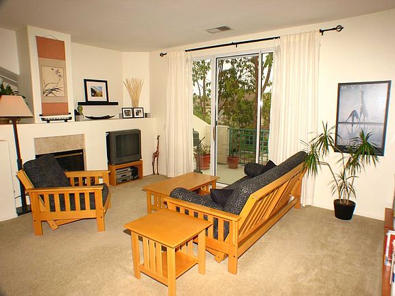 Sunlight floods into the living room.