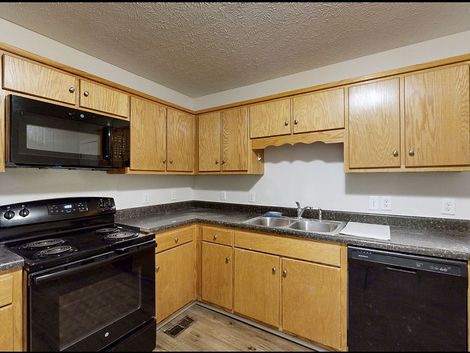 Kitchen with built-in microwave.