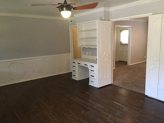 2 living rooms with desk and hutch