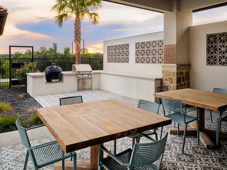 Outdoor lounge with BBQ grills and picnic areas