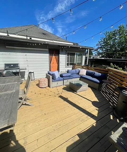 fully-furnished outdoor deck and gas grill