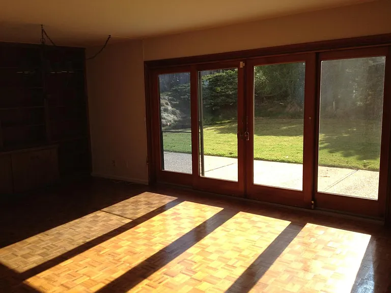 Family room which is very sunny and sliders to yard.