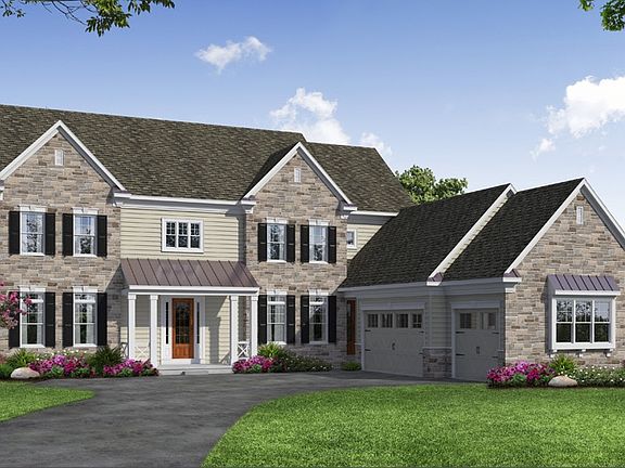 Front elevation of a Stone home from Garman Builders