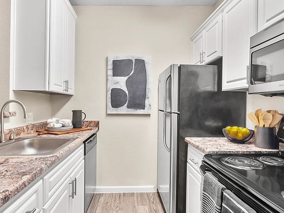 Embrace sleek, top-of-the-line appliances for refined culinary delights in your new home.