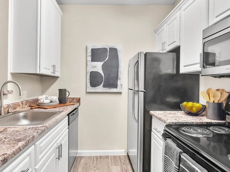 Embrace sleek, top-of-the-line appliances for refined culinary delights in your new home.