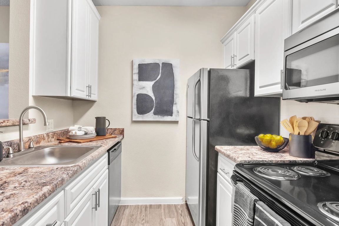 Embrace sleek, top-of-the-line appliances for refined culinary delights in your new home.