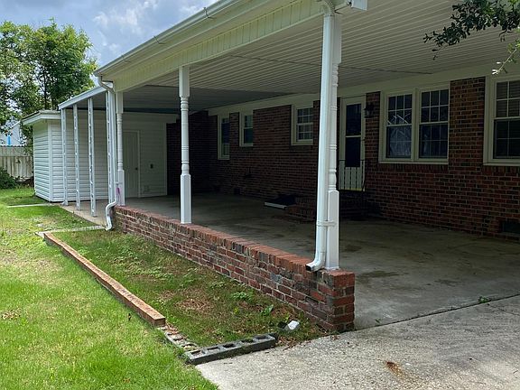 Carport attached storage shed.