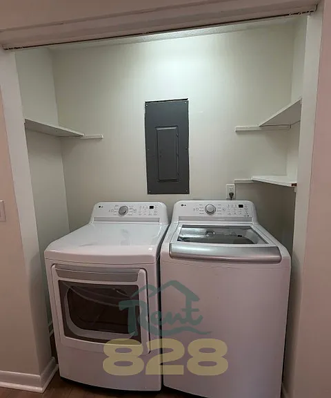 laundry closet with washer & dryer provided