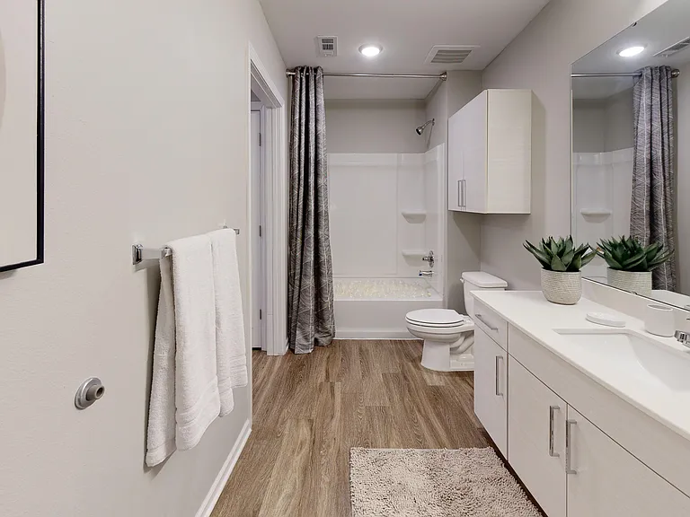 The bathroom in The Dogwood can be access directly from the bedroom or a second door from the living space. The bathroom in The Dogwood can be access directly from the bedroom or a second door from the living space.