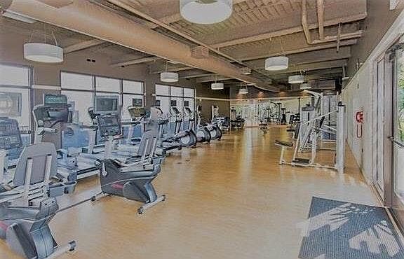 Fitness Center featuring treadmills, elliptical, exercise bi