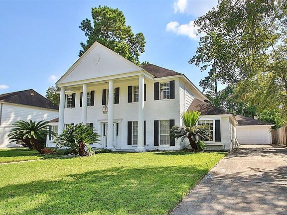 This beauty of a home wows with stately columns and great curb appeal!