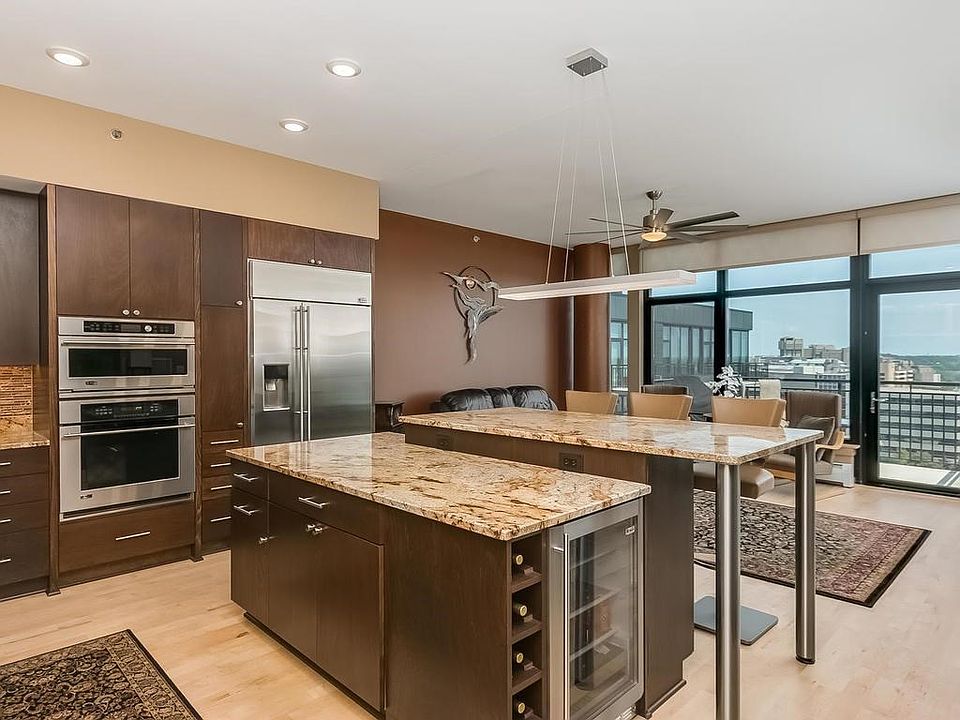 Custom Kitchen with two tiered Island, upgraded beautiful granite. This magnificent center island seats 6 and has a wine refrigerator.