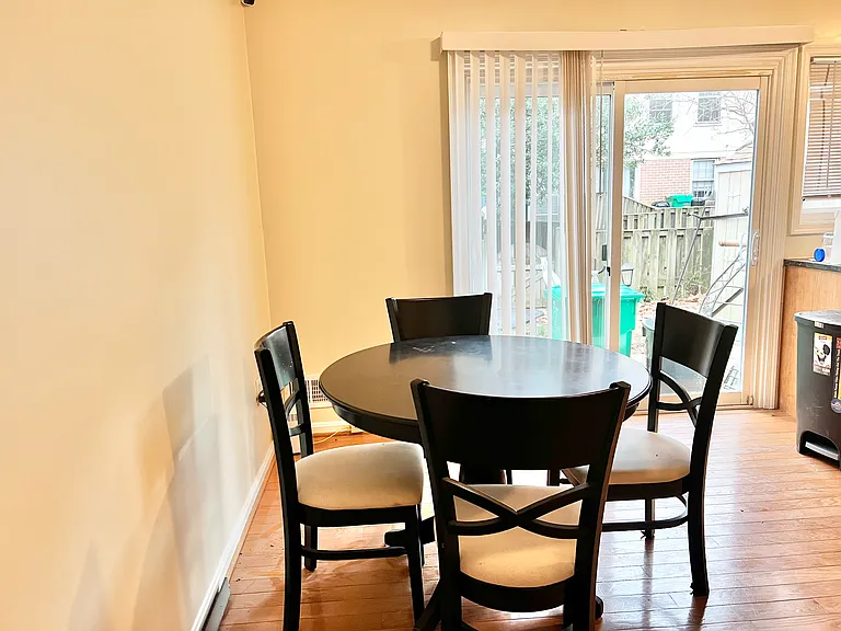 Dining Area Leading to Fenced in Back Yard