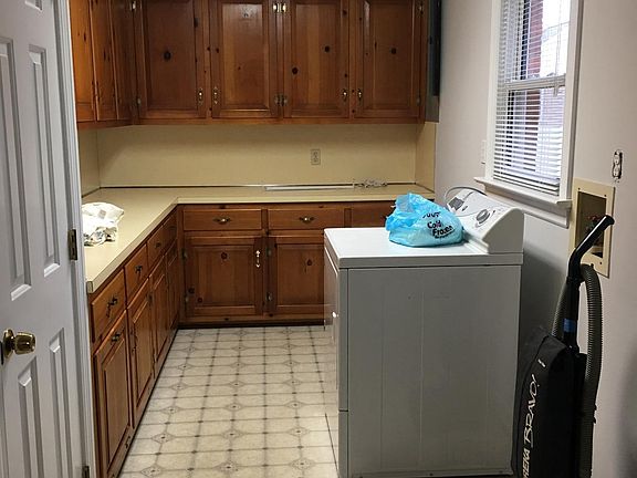 Laundry room with plenty of cabinet space.