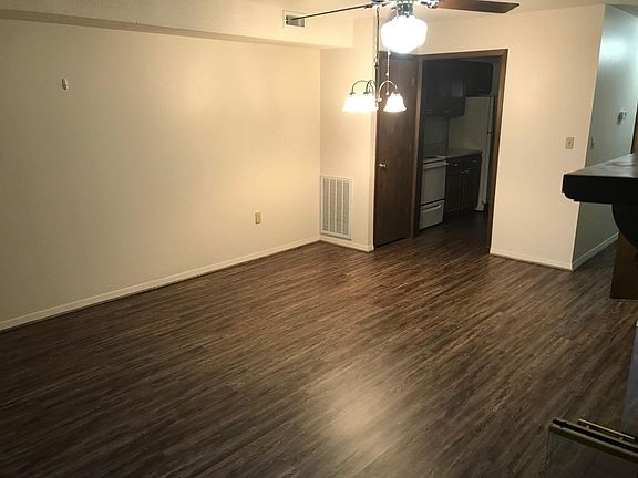 LR with kitchen doorway; foyer on right