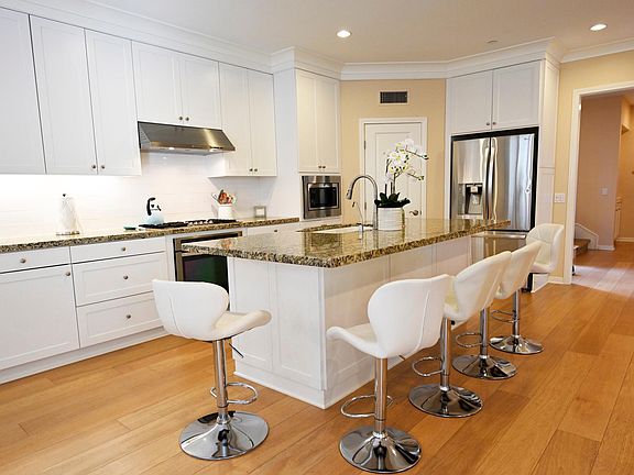 Large granite island with seating for 5.