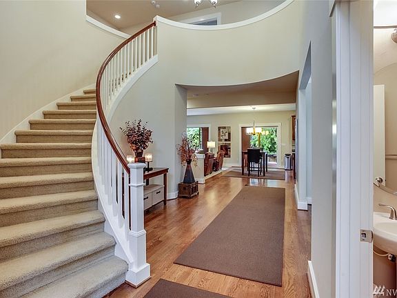 This grand entry is stunning! The curved stairway is breathtaking and draws you in to the open floor plan. This home also features a security system, interior fire-suppression sprinkler system, smart thermostat and air conditioning!