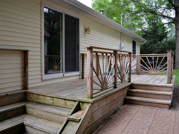 Back deck connects to the sliding back door.