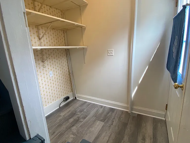 Mudroom with laundry hookups on the back entrance