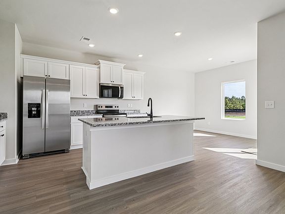 The open layout has the kitchen being open to the family room.