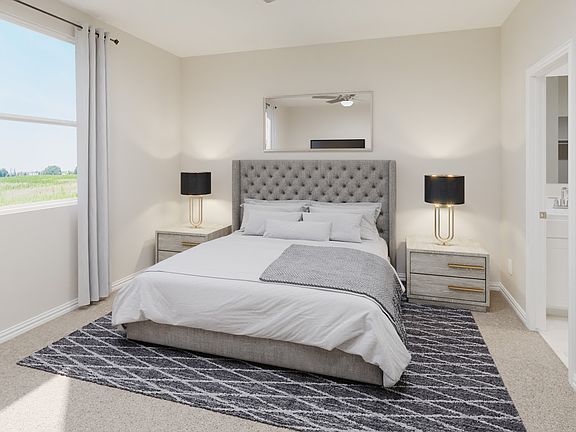 Enjoy the evening in your primary bedroom.