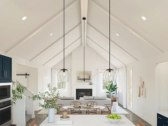 Great room with white painted ceiling beams