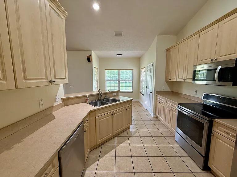 Kitchen and breakfast nook overlooking back yard