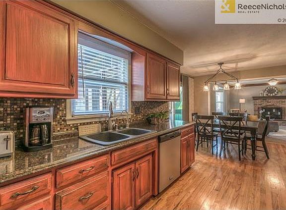 The open floor plan is great for entertaining.  Newer stainless steel dishwasher and silgranite sink.