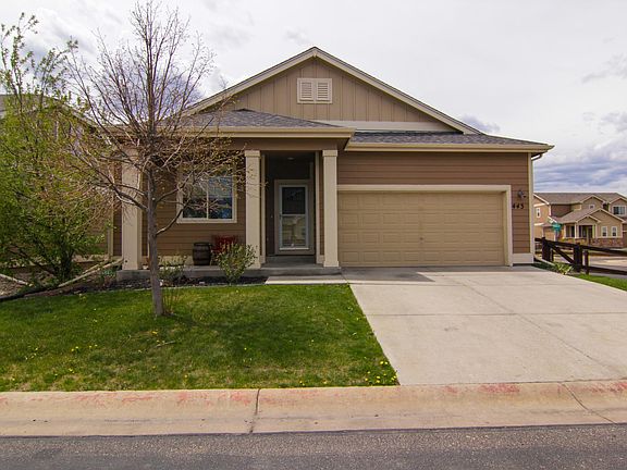 Corner lot house front view. 2 car garage, nice green lawn, and a porch. $120 credit paid to the tenant for the water bill in the summer.