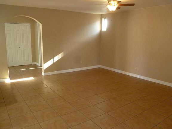 Den/Family room looking into the laundry room and storage area