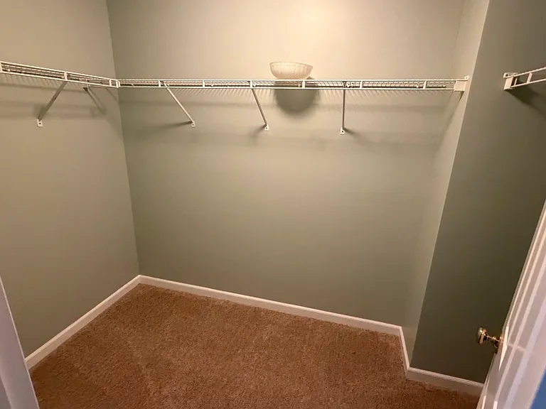 Walk-in closet next to the master bedroom.
