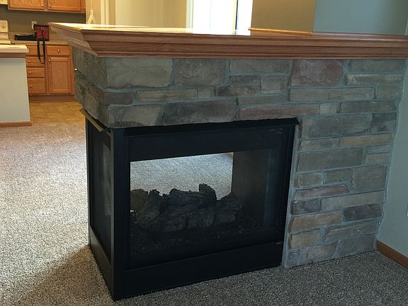 3-sided fireplace from living room to dining room