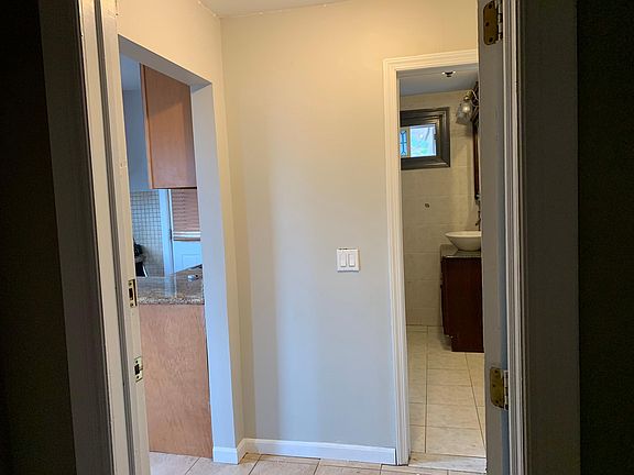 entering the 2nd floor unit-kitchen to left- bathroom in front