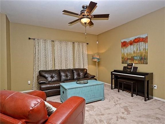 As you enter the home this is 1 of 2 family rooms.   See yourself sitting and relaxing while reading a book or visiting with a friend.