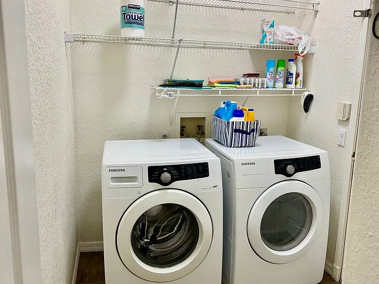 Laundry Room Washer/Dryer hanging racks. Also, Garage Door entry to the home.