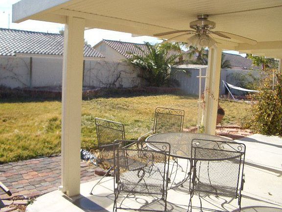 LARGE backyard and full covered patio with mounted speakers. 