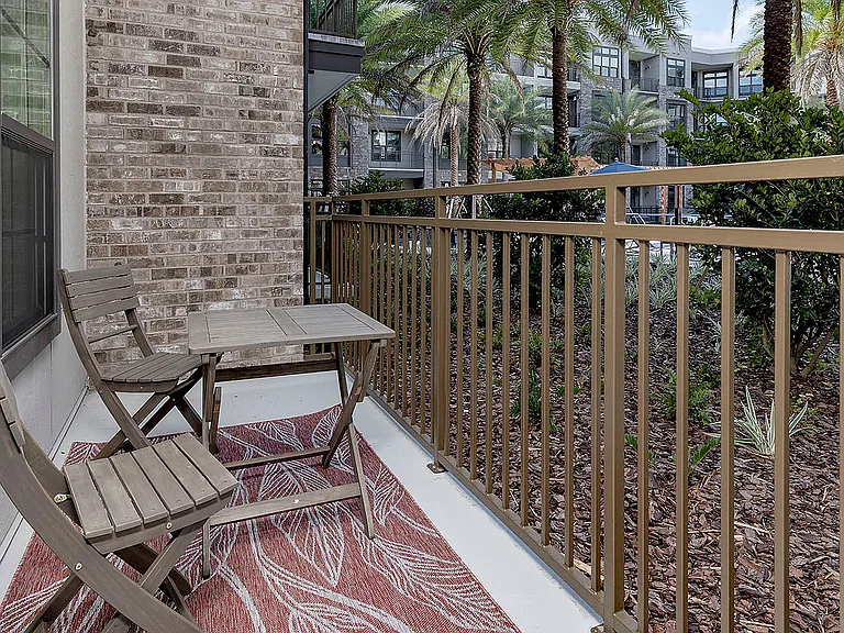 Step into this charming patio, perfect for relaxing with a view of the serene garden landscape.