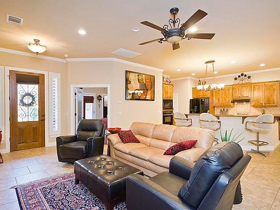 Spacious and Open Great Room Living - Crown Molding and Brick Pattern Large Ceramic Tile!