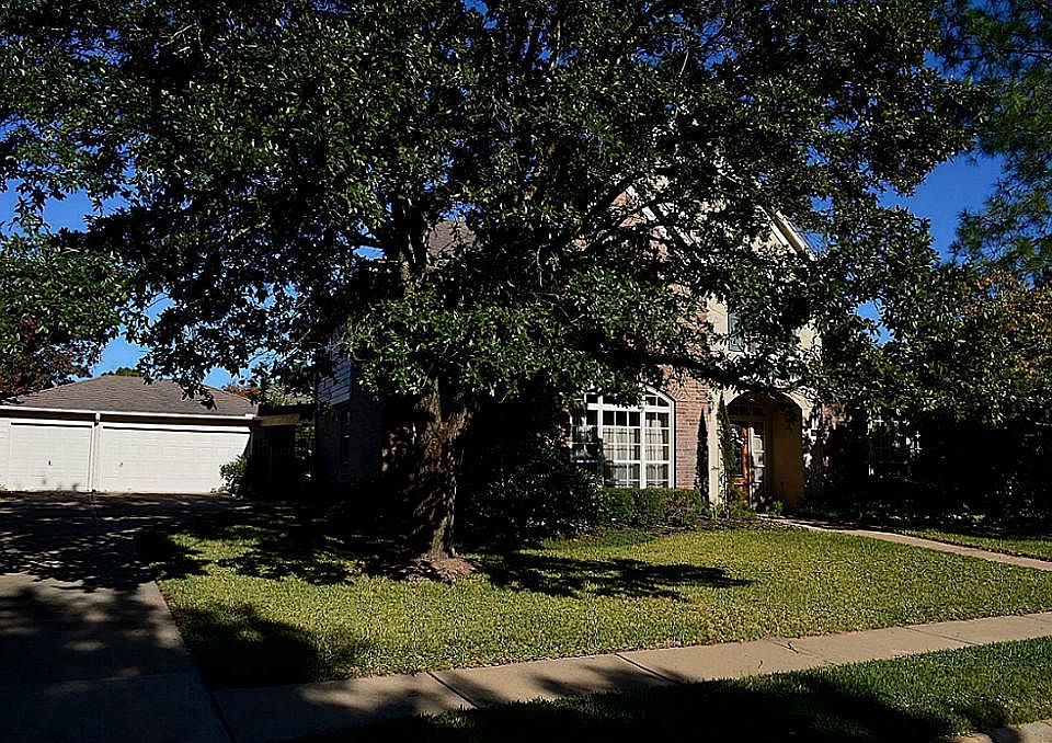 Lushly Landscaped Front & Back, Brick & Stucco Architecture provides Dramatic Entrance