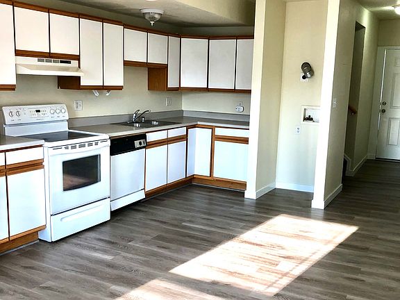 Kitchen view. A stacked washer and dryer have been installed since, in that empty space