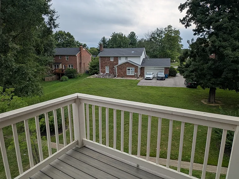 Private upper balcony with expansive, serene green space views