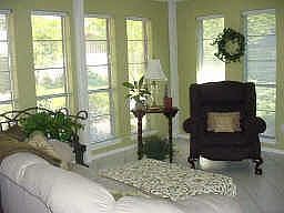 Large sunroom with lots of covered windows